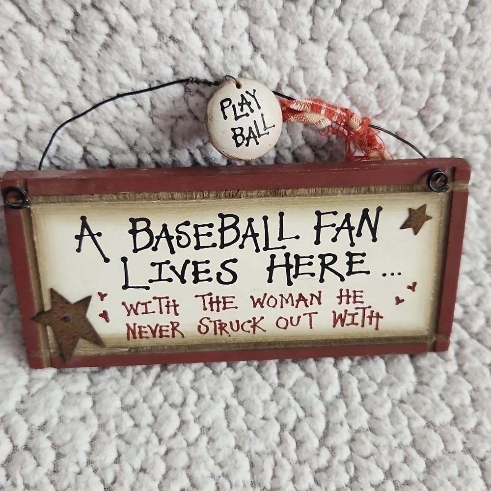 MLB A Baseball fan lives here with a woman. He never struck out with. De…